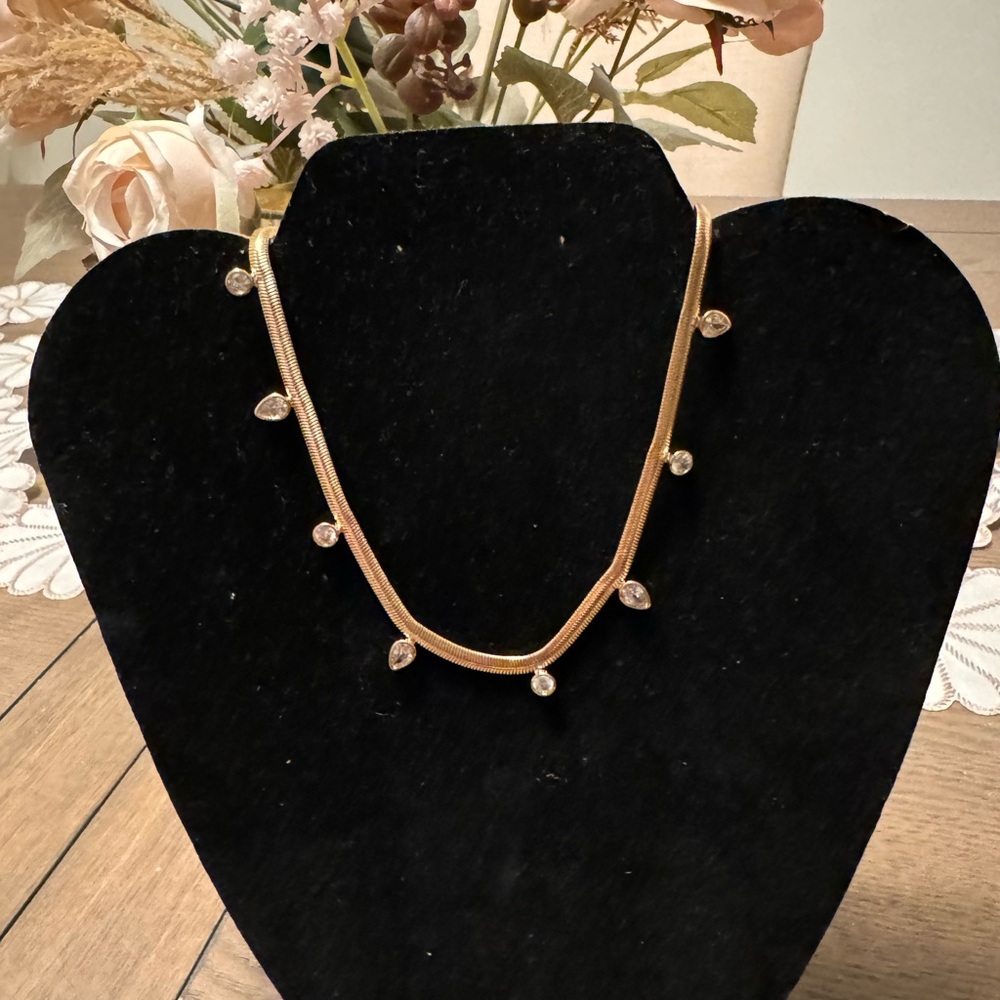 NEW with tags gold tone necklace with some CZ’s